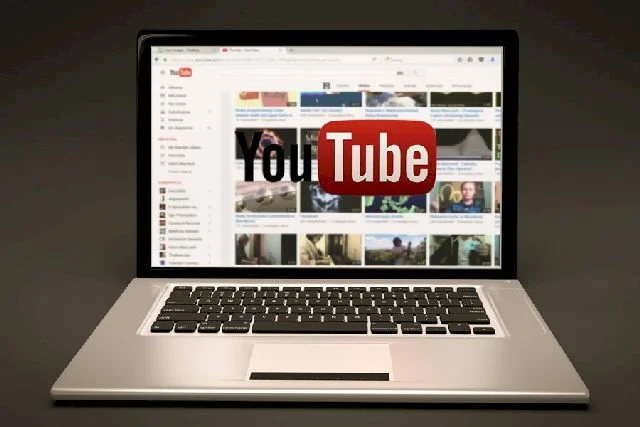 Image of a laptop superimposed with the old YouTube logo.