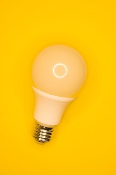 Image of a lightbulb on a yellow background.