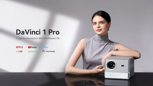 An image of a woman showcasing Wanbo's DaVinci 1 Pro projector.